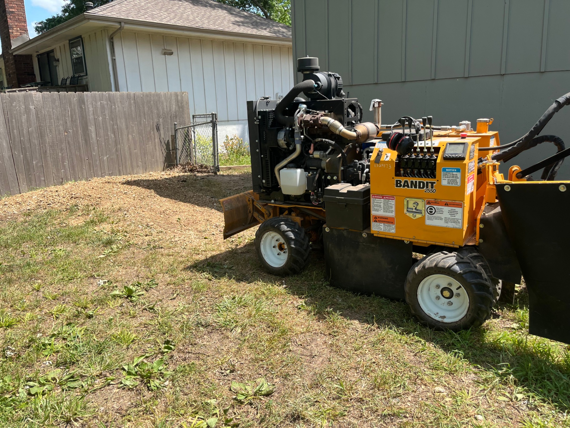 Stump grinder machine on job site